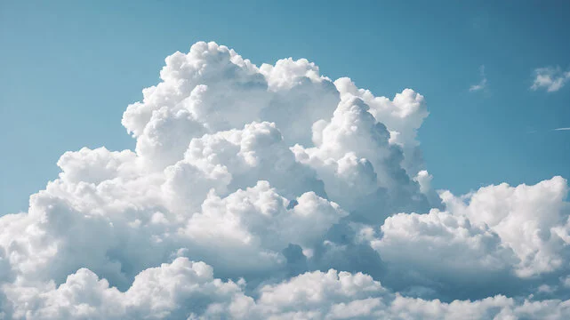 Bright cumulus clouds in a blue sky